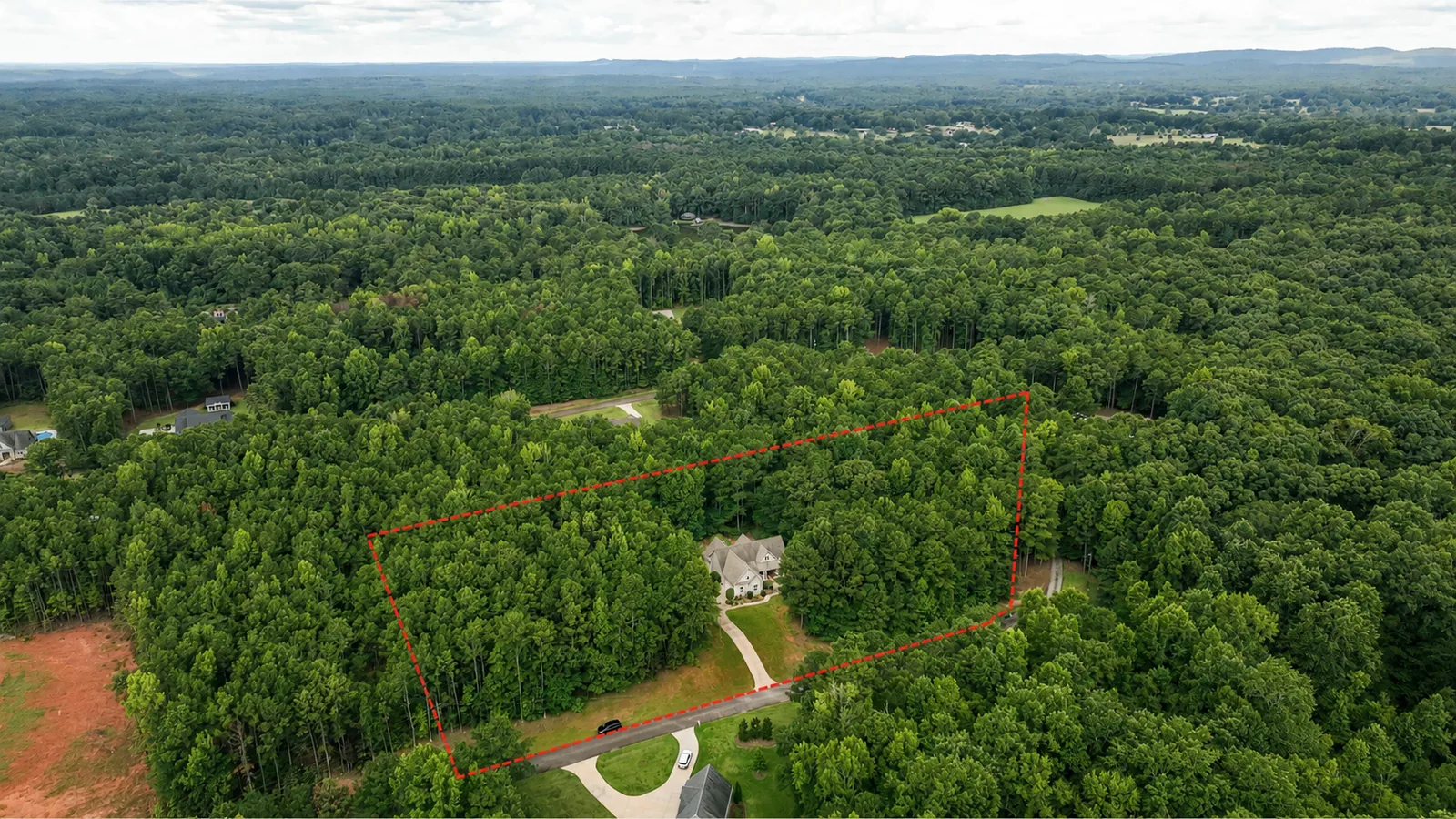 Aerial — Expansive Wooded Setting
